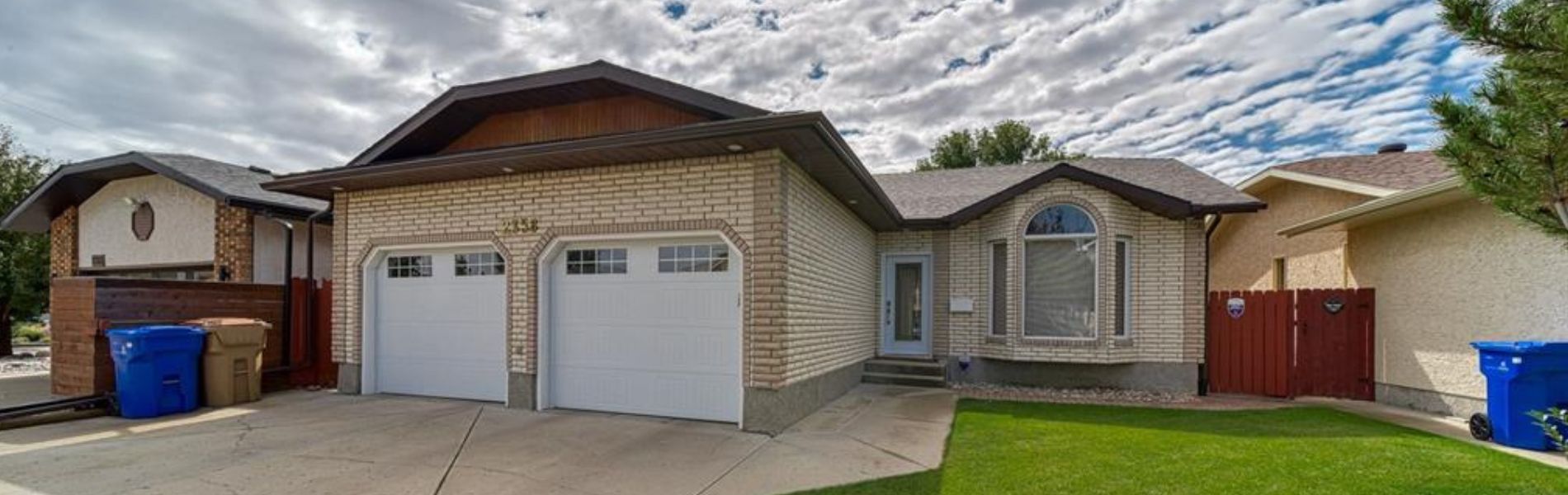 Family homes and mature trees in the Wood Meadows neighbourhood of East Regina